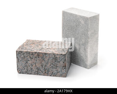 Unpolished granite and marble stone blocks isolated on white Stock Photo