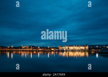 Oslo, Norway. Night View Embankment And Residential Multi-storey House On Langkaia Street In City Center In Oslo, Norway. Summer Evening. Residential Stock Photo