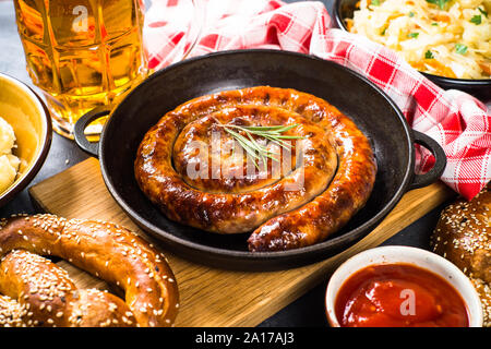 Oktoberfest food - sausage, beer and bretzel. Stock Photo