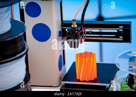 3D Printer Plastic filament for 3D printer and printed products in the interior of the design office Stock Photo