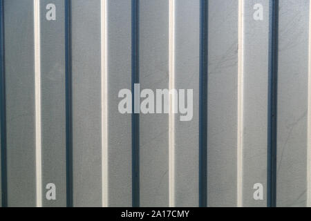 Background of corrugated gray metal sheet closeup Stock Photo