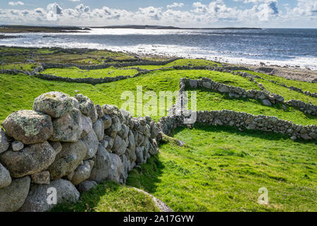 Old stone walls and the Atlantic Ocean in Doenegal Ireland Stock Photo