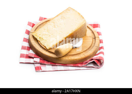 Block of tasty cheese on cutting boars and cheese knife isolated on white background. Stock Photo