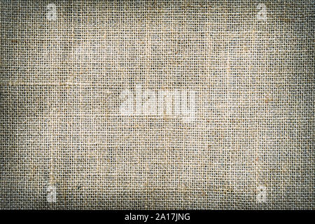 Natural canvas, sackcloth. Closeup of jute texture pattern with vignette, for vintage background Stock Photo