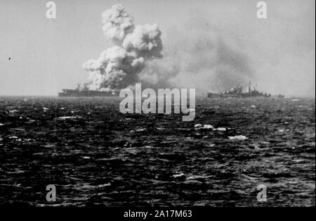 The Battle of Leyte Gulf, the largest naval battle of World War II. The U.S. Navy light aircraft carrier USS Princeton (CVL-23) burning soon after she was hit by a Japanese bomb while operating off the Philippines on 24 October 1944 Stock Photo