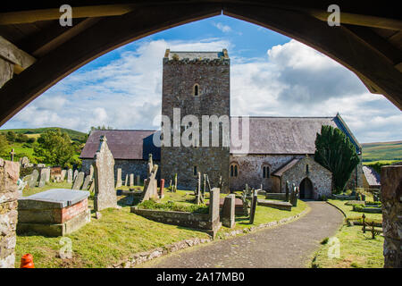 St Cenydd’s Church, Llangennith , a 12th century church on the site of a 6th century llan, or churchyard, which retains the original circular footprint. Llangennith, Gower Wales UK Stock Photo