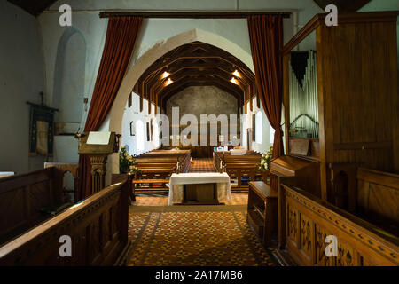 St Cenydd’s Church, Llangennith , a 12th century church on the site of a 6th century llan, or churchyard, which retains the original circular footprint. Llangennith, Gower Wales UK Stock Photo