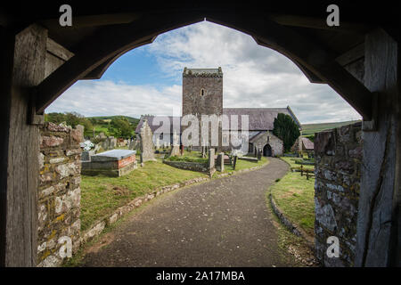 St Cenydd’s Church, Llangennith , a 12th century church on the site of a 6th century llan, or churchyard, which retains the original circular footprint. Llangennith, Gower Wales UK Stock Photo