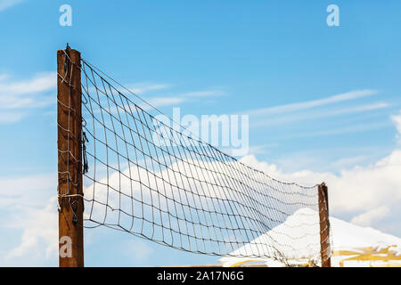 Volleyball net on the beach against the blue sky Stock Photo
