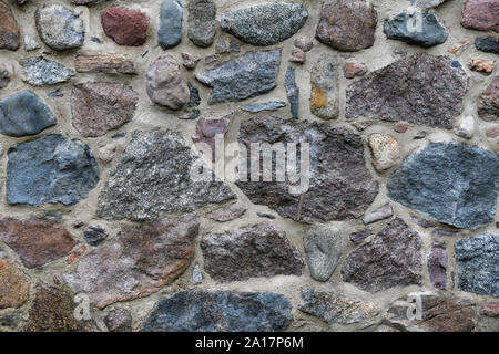 Old stone Wall with Lots of Texture and Color. Stock Photo