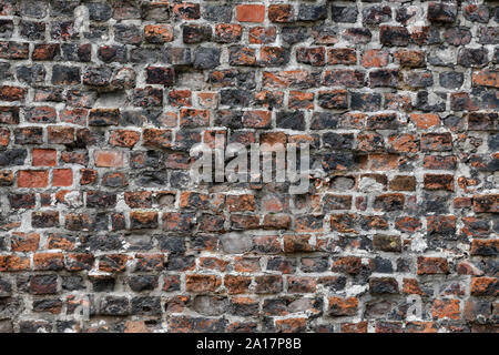 Old Red Brick Wall with Lots of Texture and Color. Stock Photo