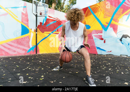 Portrait of a Basketball Player dribbling the ball Stock Photo