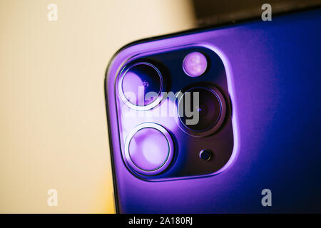 Paris, France - Sep 20, 2019: Close-up macro details of new latest Apple Computers iPhone 11 Pro and 11 Pro Max smartphone triple-lens camera and new technology - Midnight green color Stock Photo