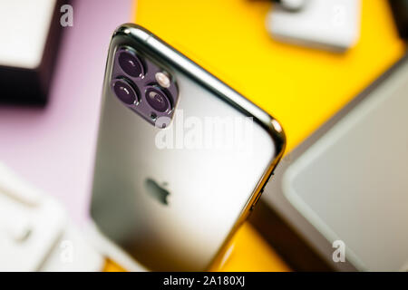 Paris, France - Sep 20, 2019: Above close-up macro details of new latest Apple Computers iPhone 11 Pro and 11 Pro Max smartphone triple-lens camera and new technology - Midnight green color Stock Photo