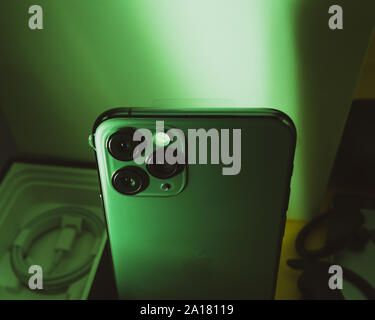 Paris, France - Sep 20, 2019: View from above of ultra-Wide, Wide, and Telephoto lenses on the new latest Apple Computers iPhone 11 Pro and 11 Pro Max smartphone triple-lens - green color cast Stock Photo