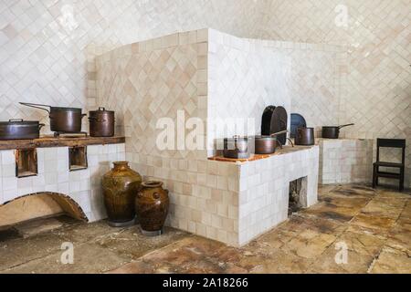 Copper utensils in vintage kitchen with baking stove, Sintra National Palace, Portugal Stock Photo