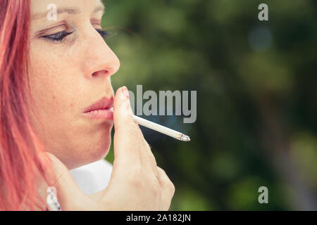 spitting while smoking cigarettes Eight Ways to Avoid Spit-Back When Vaping Man Spitting Tobacco] - The