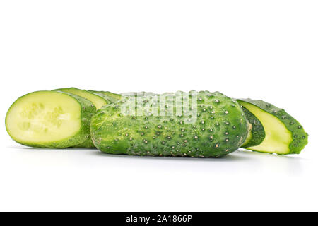 One whole lot of slices of fresh pickling cucumber isolated on white background Stock Photo