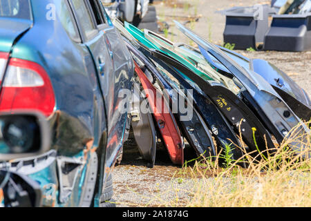 Spare parts. Many car doors for aftermarket for shop auto service. Stock Photo