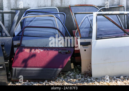 Spare parts. Many car doors for aftermarket for shop auto service. Stock Photo