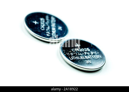 Closeup of Lithium button cell battery isolated on white Stock Photo
