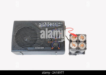 The old transistor radio, backup battery, Lithium phosphate battery power bank,DIY by yourself on the white background. Stock Photo