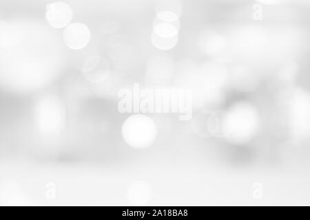 Abstract black and white bright bokeh background with white table top for backdrop design, bokeh composition for , website, magazine or graphic for