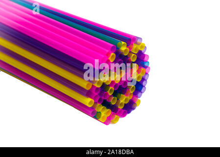 Set of colored straws for drinking cocktails. Colorful straws for a cocktail. Background of colored tubes. Stock Photo