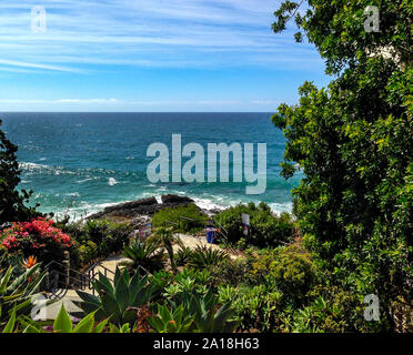 Vibrant ocean and sky seascape with Mediterranean style plants in a park setting. Bette Davis once owned a home overlooking this exquisite cove. Stock Photo