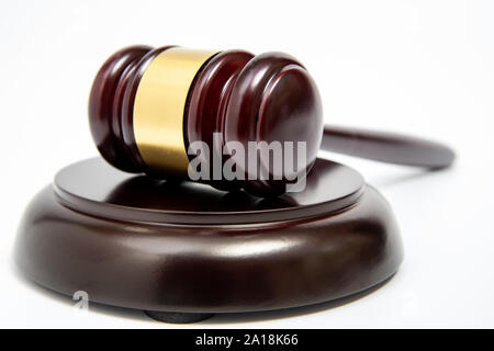 A wooden judge gavel isolated on white background. Stock Photo