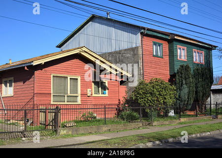 OSORNO, CHILE - SEPTEMBER 12, 2015: Typical house of the region made of wood and corrugated metal roof in the city of Osorno in Chile Stock Photo