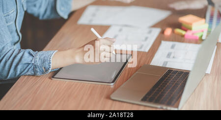 Cropped view of professional male UX web designer working on his new smartphone templates project while using blank screen tablet Stock Photo