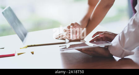 Cropped view of professional male UX web designer working on his new smartphone templates project while using tablet Stock Photo