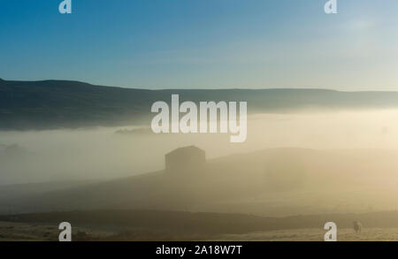 Misty morning in spring, Hawes, Wensleydale, UK. Stock Photo