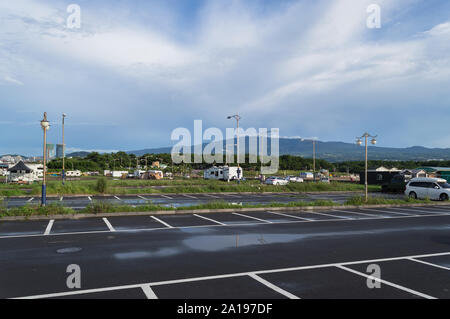 parking lot near Iho Tewoo Beach after rain on Jeju island with beautiful cloudscape on background Stock Photo