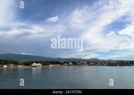 view form nearby pier on Iho Tewoo Beach and lanscape of jeju island with scenic cloudscape Stock Photo