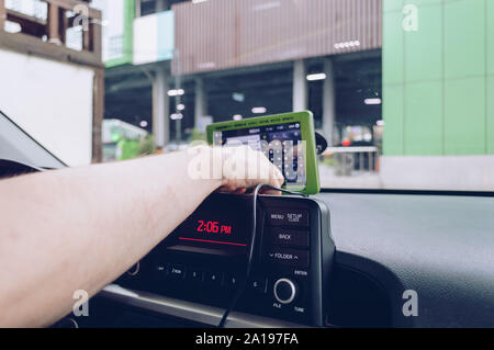 man is using navigation device inside a car Stock Photo
