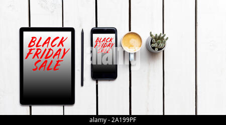 Black Friday sales banner with text on device screens for online sales Stock Photo