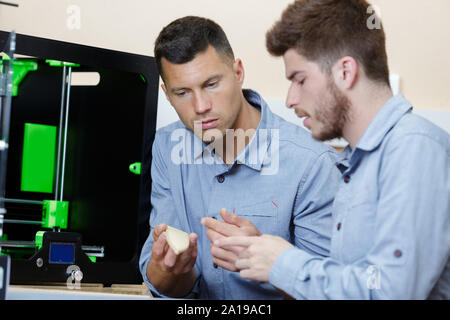 young talented male engineers in a modern laboratory Stock Photo