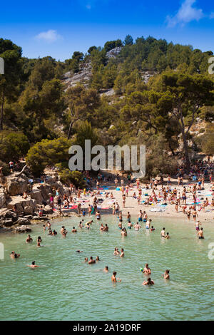 Beach lovers in Calanque de Port-Pin, Calanques National Park, Cassis, Bouches-du-Rhône, Provence-Alpes-Côte d'Azur, France, Europe Stock Photo