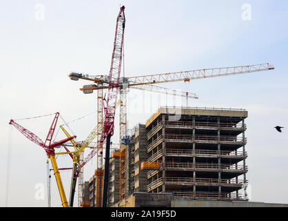 Germany. 10th Sep, 2019. Various cranes are in use on the construction site of the former Technical Town Hall of the City of Leipzig. The 170-metre-long former office complex near the city centre will be divided into four nine-storey towers of the same type, which will only remain connected in the base. CG Gruppe AG, a subsidiary of Consus Real Estate AG, plans to build a new residential complex with 280 apartments by 2020. Credit: Waltraud Grubitzsch/dpa-Zentralbild/dpa/Alamy Live News Stock Photo