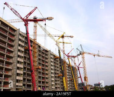 Germany. 10th Sep, 2019. Various cranes are in use on the construction site of the former Technical Town Hall of the City of Leipzig. The 170-metre-long former office complex near the city centre will be divided into four nine-storey towers of the same type, which will only remain connected in the base. CG Gruppe AG, a subsidiary of Consus Real Estate AG, plans to build a new residential complex with 280 apartments by 2020. Credit: Waltraud Grubitzsch/dpa-Zentralbild/ZB/dpa/Alamy Live News Stock Photo