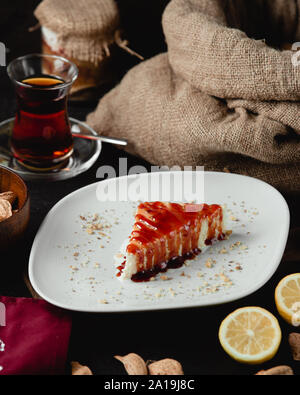 Cheese cake with strawberry syrup Stock Photo