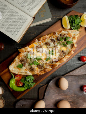 Turkish pide with meat and eggs Stock Photo