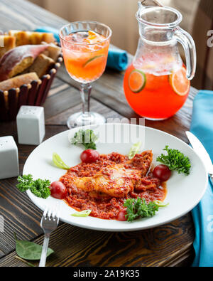 Meat lasagna with vegetables and lemonade Stock Photo