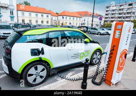 Electric car being charged, Warsaw, Poland Stock Photo