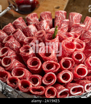Meat roulets carpaccio on the table Stock Photo