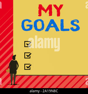Handwriting text writing My Goals. Conceptual photo Future or desired result that a demonstrating commits to achieve Man stands in back view in front Stock Photo