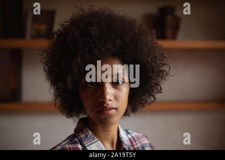 Portrait of a young woman at home Stock Photo