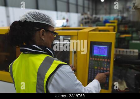 Female factory worker in a factory Stock Photo